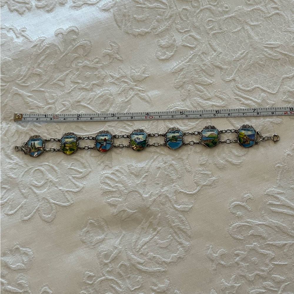 Vintage enamel charm bracelet of Swiss towns.